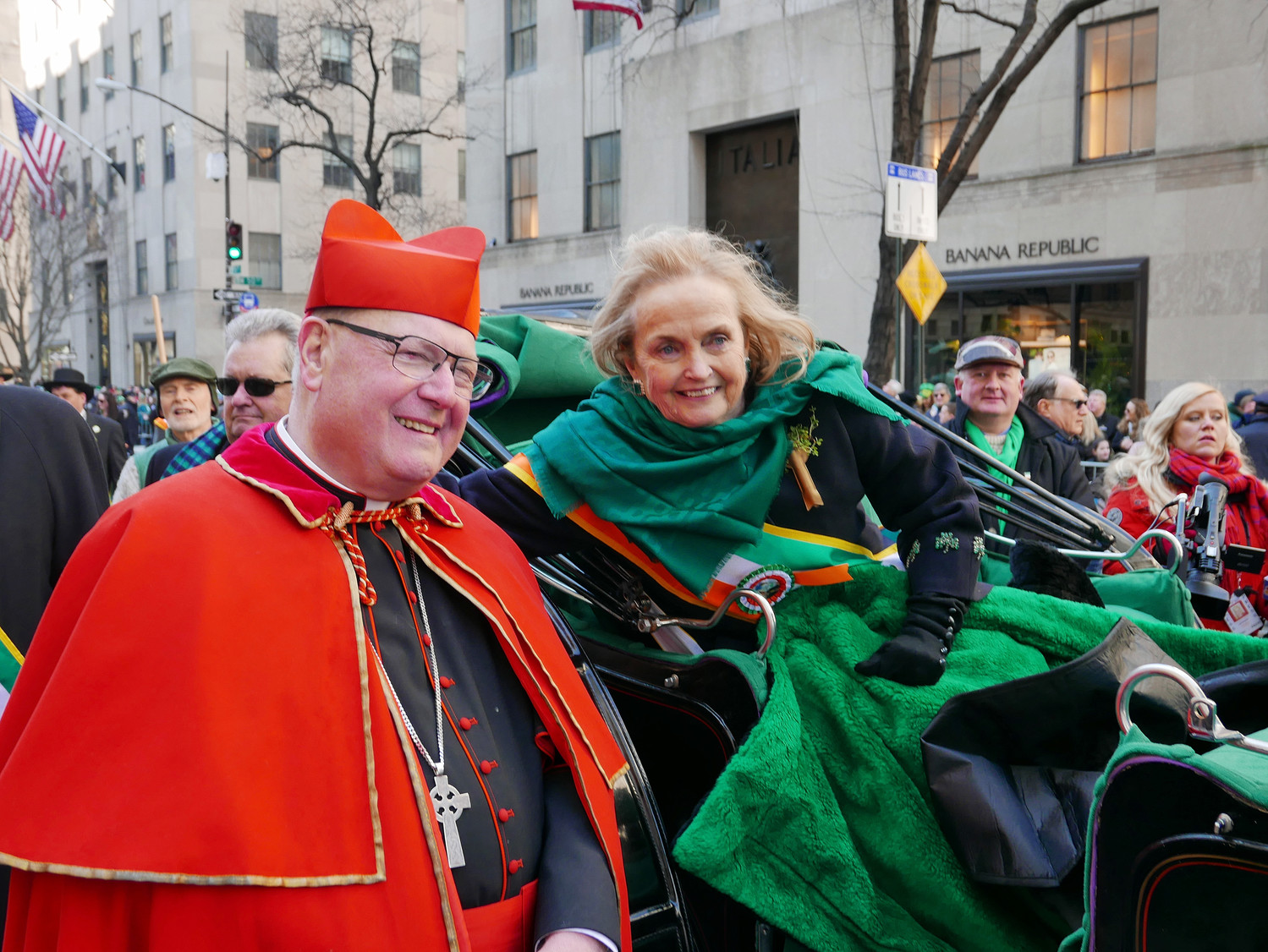 Cardinal Dolan greets Loretta Brennan Glucksman, the grand marshal of the 257th New York City St. Patrick’s Day Parade, who led the March 17 march up Fifth Avenue while riding with her grandson, Liam Picco, 15, in their favorite hansom cab.