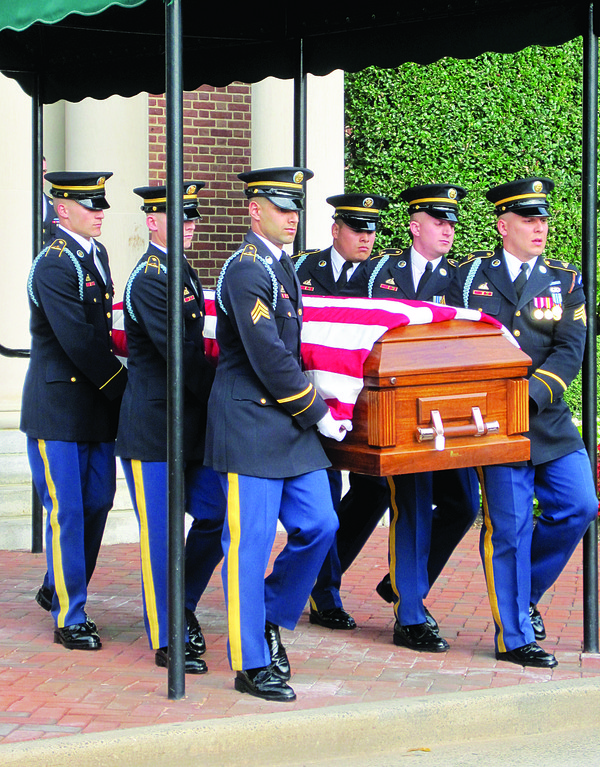 HERO COMES HOME—Military pallbearers carry the remains of Staff Sergeant John R. Simonetti, a soldier of World War II, to his final resting place at Arlington National Cemetery.  Simonetti, killed in action in France 10 days after D-Day, had been listed as missing for 65 years.