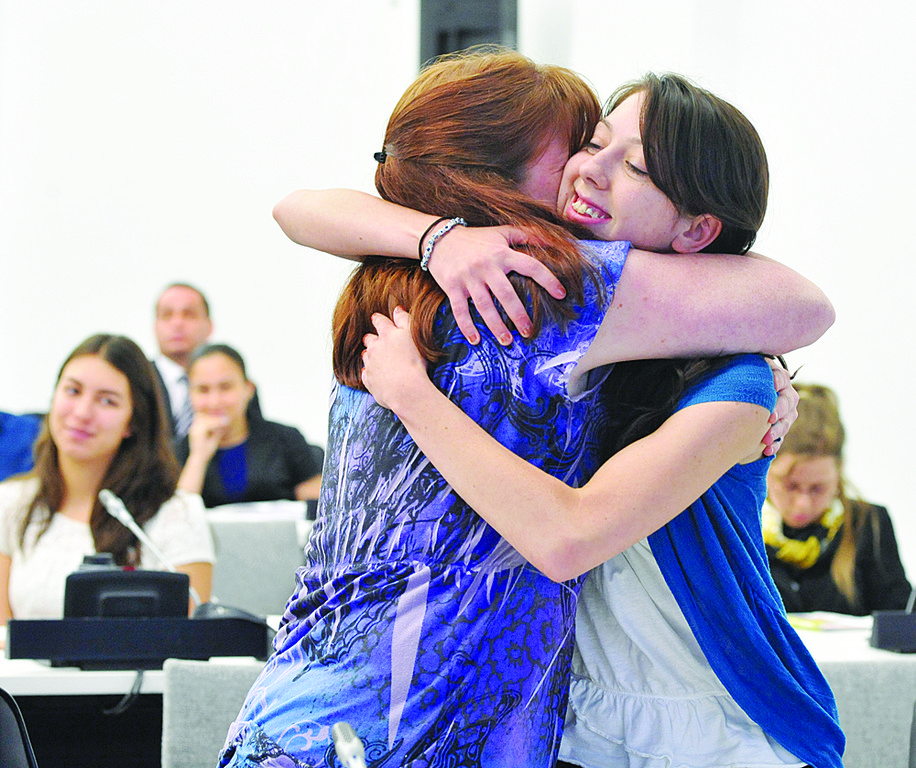 SPIRITED-Samantha Lindsay, winner of a trip to World Youth Day in Madrid, is hugged by her aunt, Bernadette Cocharelli. Samantha is a student at Preston High School in the Bronx.