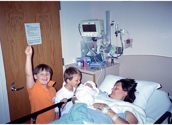 FAMILY MOMENT—Alessandra Rose and her sons, Harry and Charlie, welcome their sister Marguerite into the world in 2005. The infant, who had Trisomy 13, lived for four hours. “I wanted this baby to have an opportunity at life, and I wanted my boys to have an opportunity to love her,” Mrs. Rose said.