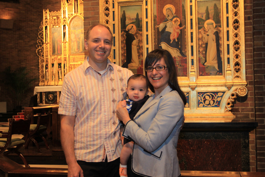 BABY MAKES THREE—Daniel and Genevieve Fiorito bond with baby Matteo Francesco, their seven-month-old son. The couple, of Our Saviour parish in Manhattan, adopted the boy shortly after they offered prayers for a child at the archdiocese’s annual St. Gianna Mass last year. Several other new parents also cite the saint’s intercession for the blessings of their children.