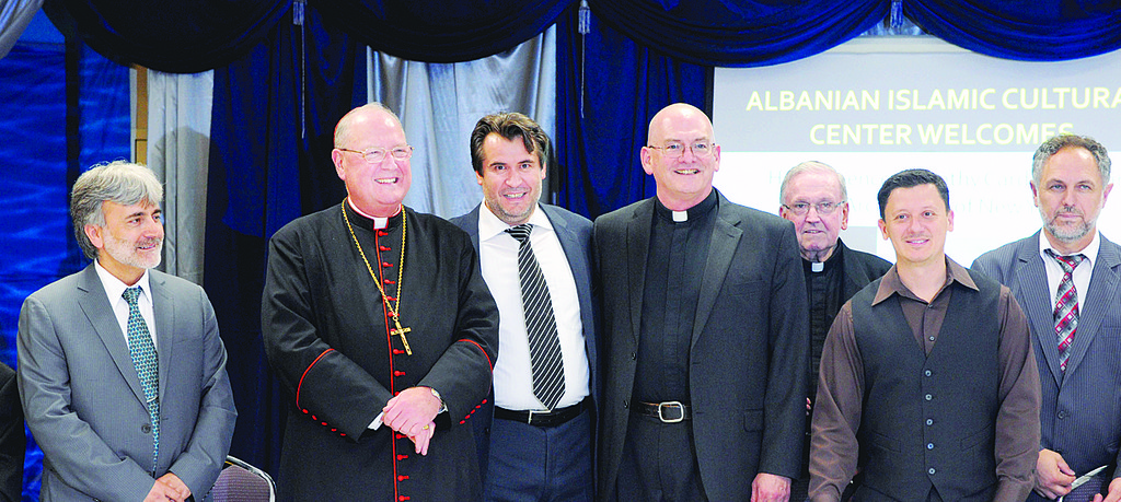 from left to right are: Zurkani Vardar, president of the Center; Cardinal Dolan; Dr. Tahir Kukiqi, PhD, imam and vice president of the Center; Father Liam T. O'Doherty, O.S.A., pastor of Our Lady of Good Counsel in Tompkinsville; Msgr. Peter Finn, pastor of Blessed Sacrament Church and co-vicar of Staten Island; Smet Caprec, a teacher in the Center’s high school; and imam Ferid Bedrolli.