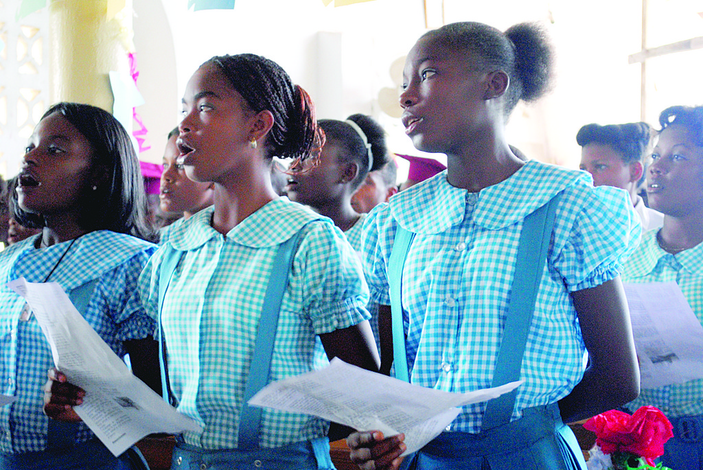 The St. Jean Baptiste parish choir sings during Mass.