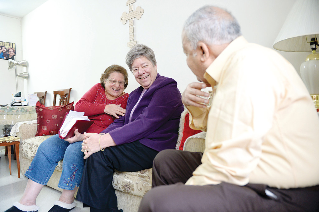 Sister Donna Dodge, S.C., CEO and executive director of the Sisters of Charity Housing Development Corporation, enjoys conversation and camaraderie with Albert Abdelmesih and his wife, Lourice Tadros.