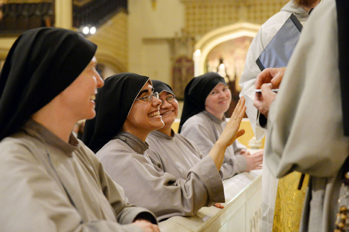 Sister Chiara Rose Fedele, C.F.R.,  smiles as she receives her ring as part of the rite.