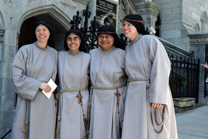 The sisters celebrate outside the church: Sister John Paul Marie Spinharney, C.F.R., at far left; Sister Chiara Rose Fedele, C.F.R.; Sister Guadalupe Magdalena Gonzalez, C.F.R. and Sister Kelly Francis Oslin, C.F.R.