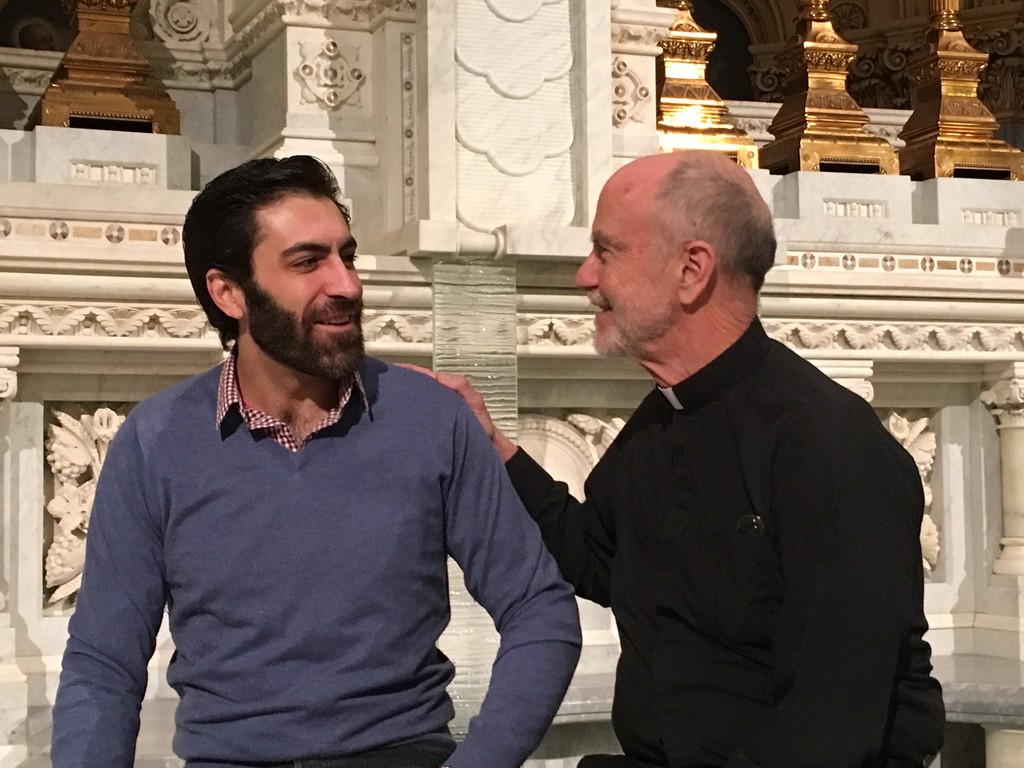 It was created by Father Robert VerEecke S.J., pastor of St. Francis Xavier parish in Manhattan, seen at right, with Christopher Tocco, the actor who plays the role of St. Luke the Evangelist.