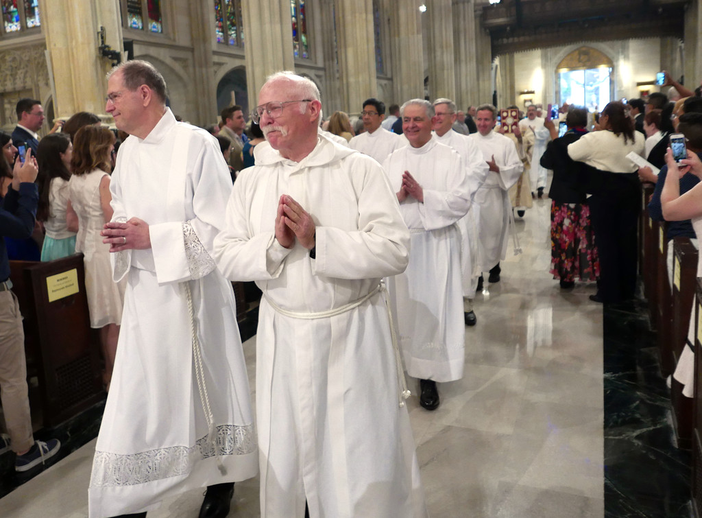 HAPPY OCCASION—Beaming expressions of Deacon John Hoey and Deacon Bernard ‘Barney’ Kahn tell the story as they lead the processional for the Mass of Ordination in St. Patrick’s Cathedral June 17.