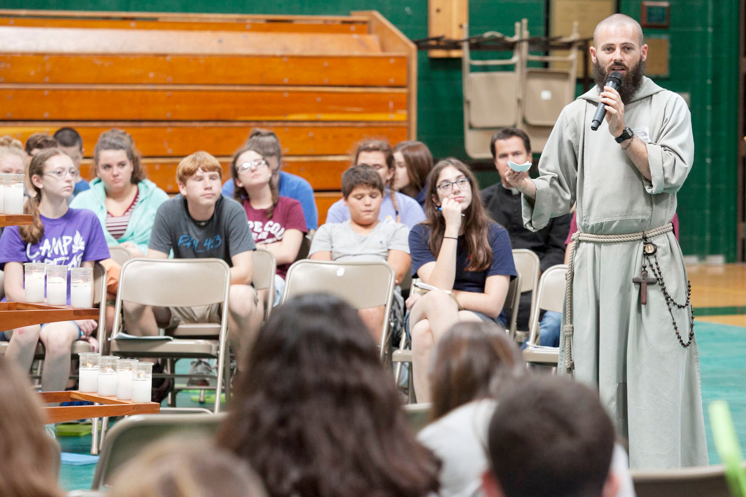 TEEN RETREAT—Brother Benjamin Emmanuel, C.F.R., answers a written question from a camper during a question-and-answer session at the Fearless Retreat at John A. Coleman Catholic High School in Hurley Sept. 16. Brother Emmanuel was on the panel with Father Chris Argano, vocations director for the archdiocese; Matthew Breslin, a seminarian at St. Joseph’s Seminary, Dunwoodie; and Jennifer Edwards, executive assistant of Fearless Retreat.