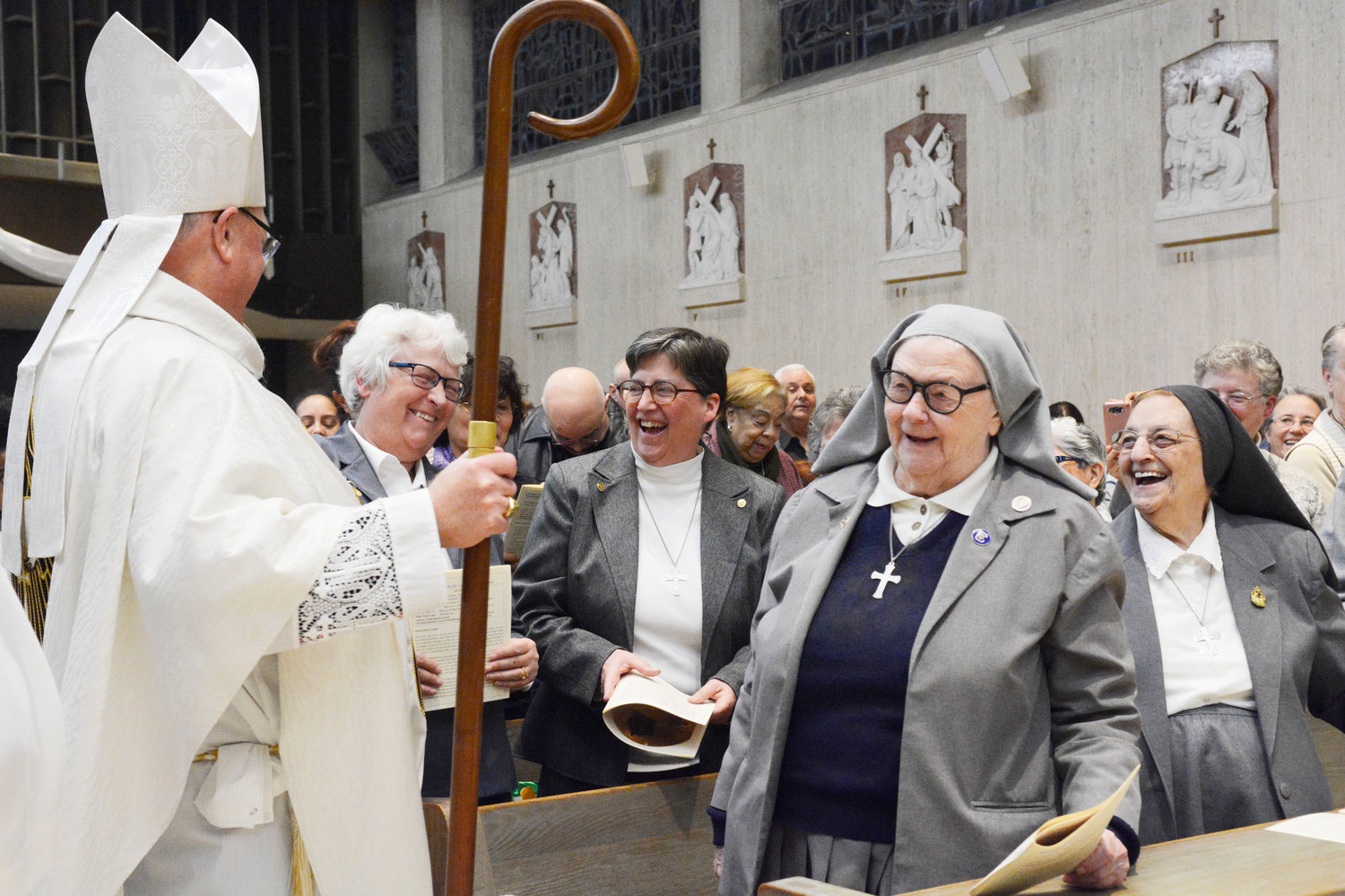 Cardinal Dolan speaks with Missionary Sisters of the Sacred Heart of Jesus, including Sister Barbara Louise Staley, M.S.C., general superior, second row left, at St. Frances Cabrini Shrine in Manhattan Dec. 16.