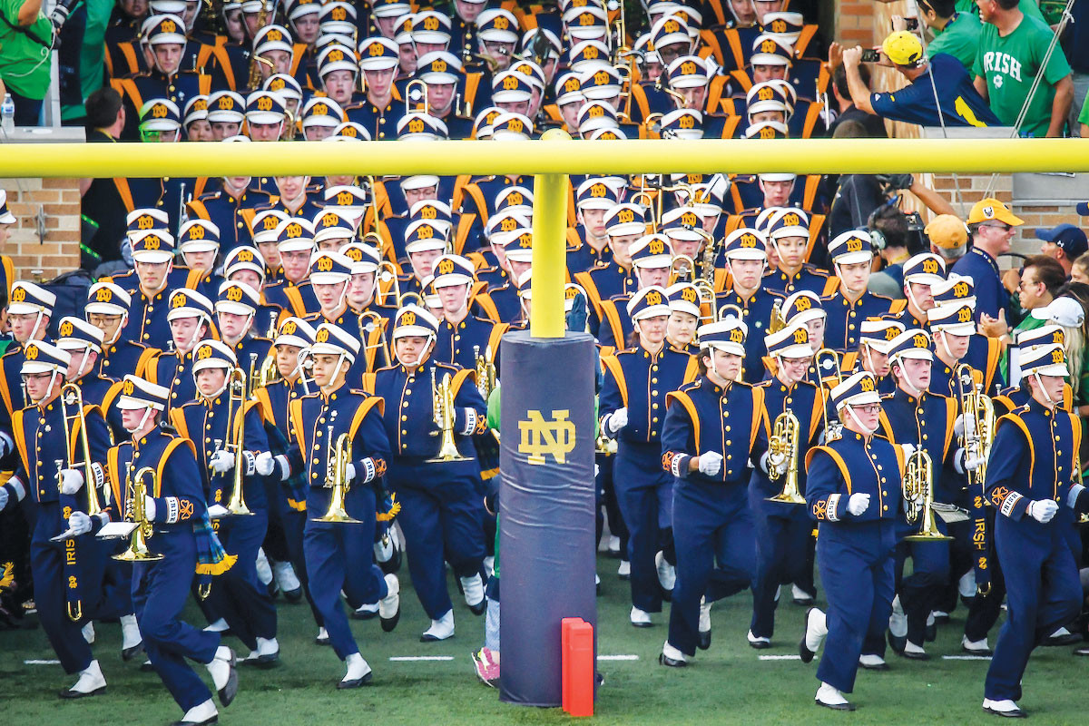 The University of Notre Dame Marching Band runs onto the field before a college football game between the Fighting Irish and the University of Michigan at Notre Dame Stadium in South Bend, Ind., Sept. 1. The marching band is known for playing Notre Dame’s “Victory March” fight song at athletic events.