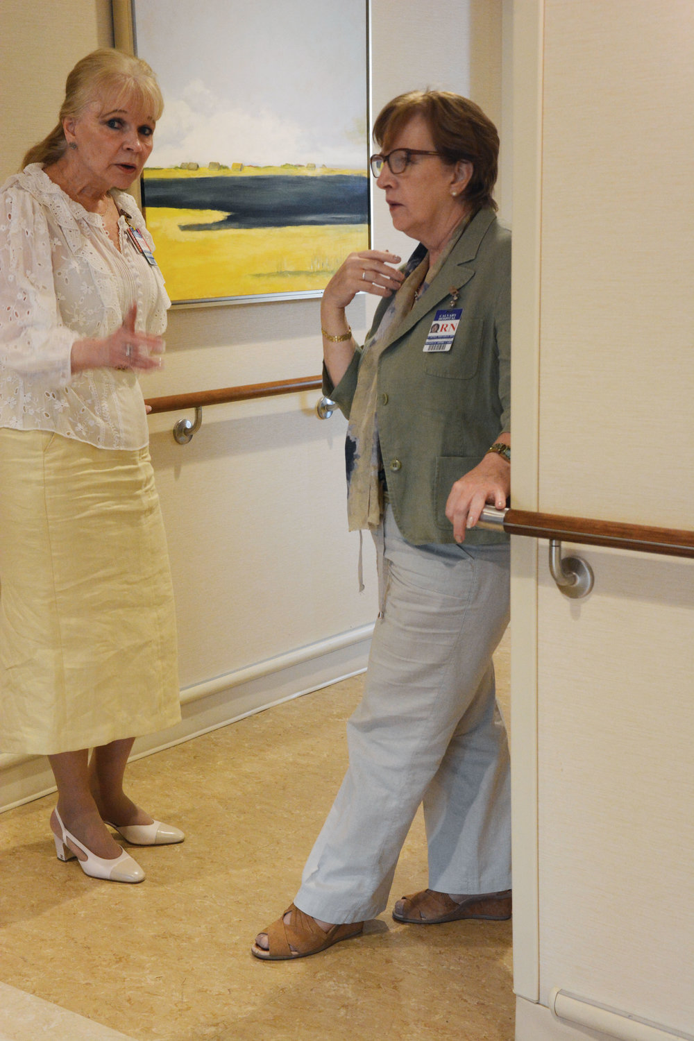 Dr. Gail Chrzanowski, M.D., medical director of The Dawn Greene Hospice, left, and Carmel Monahan, R.N., director of patient services of Calvary@Home, converse at The Dawn Greene Hospice at Mary Manning Walsh Home in Manhattan June 5.