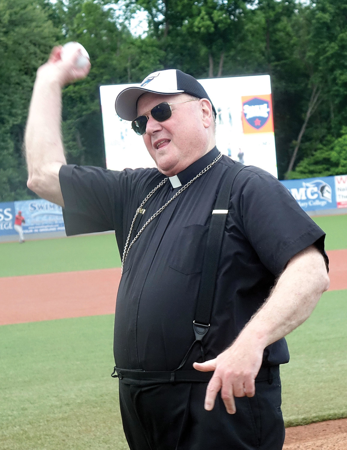 Cardinal Dolan throws out a ceremonial first pitch before the New York-Penn League game between the Hudson Valley Renegades and Lowell Spinners.