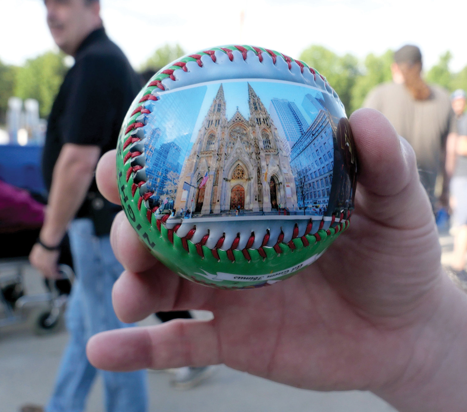 A commemorative baseball, which was given to fans, features an image of St. Patrick’s Cathedral.