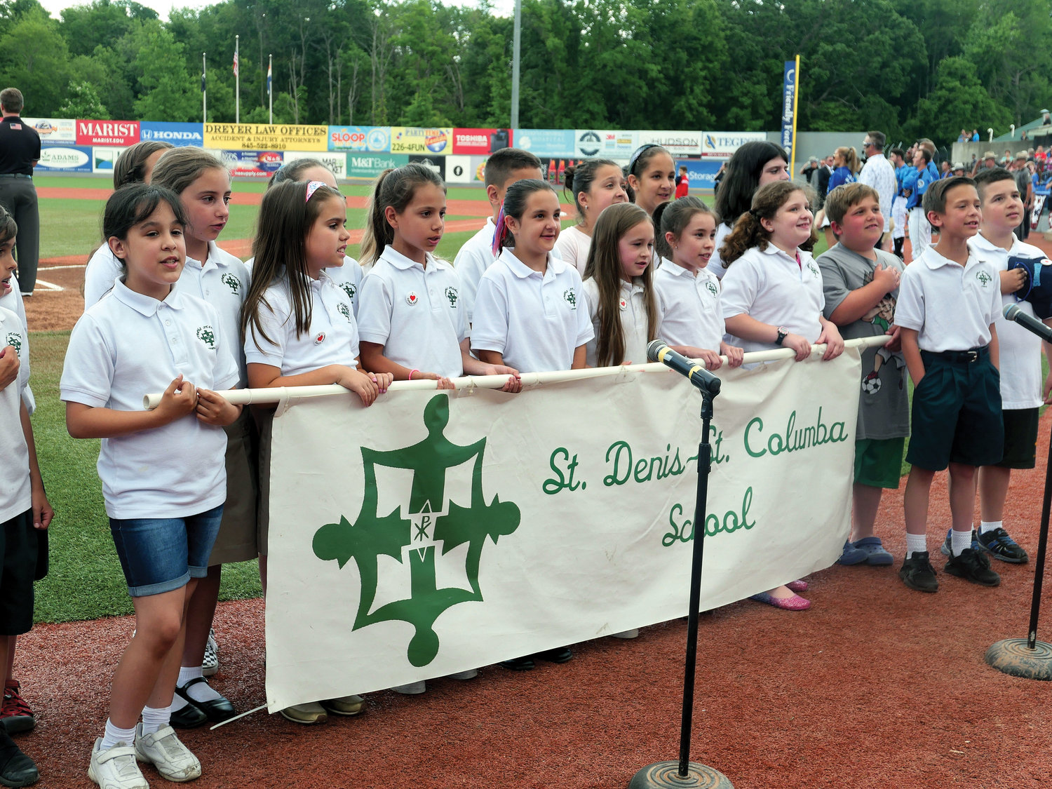 Students from St. Denis-St. Columba School in Hopewell Junction sing the National Anthem.