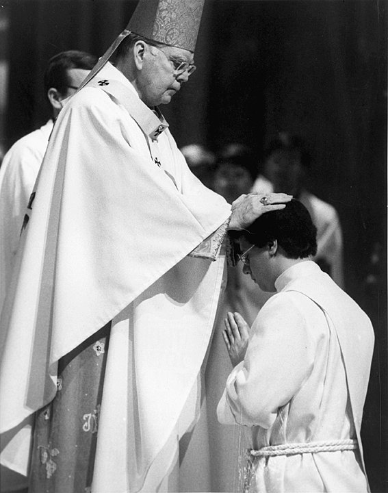 ORDINATION RITES—Cardinal Terence Cooke lays hands on Father Gerardo Colacicco during the Mass at which he was ordained to the priesthood in St. Patrick’s Cathedral Nov. 6, 1982.