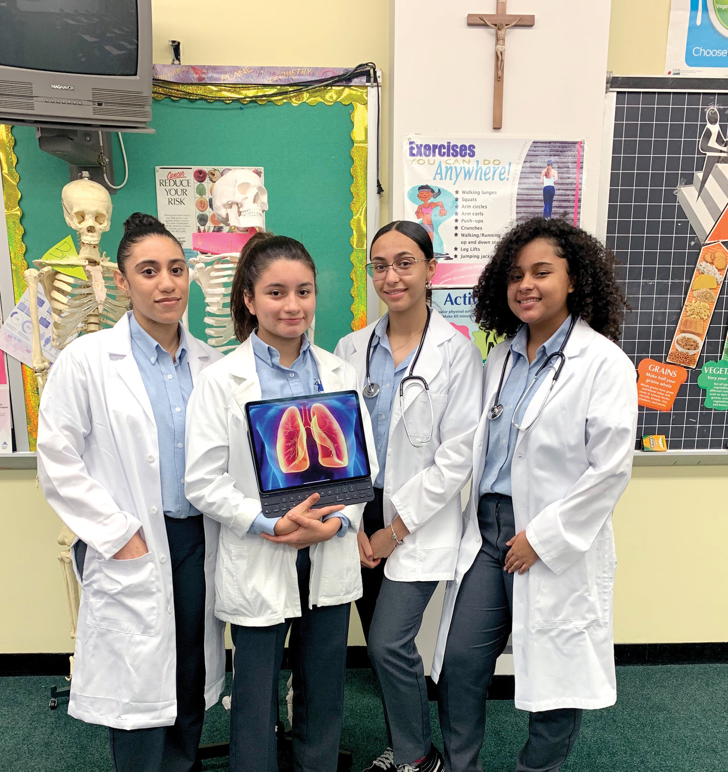 ENRICHMENT PROGRAM—The four juniors from Cathedral High School in Manhattan participating in an internship at Memorial Sloan Kettering Cancer Center in Manhattan are, from left, Skyla Collado, Annette Malan, Taiana Corchado and Thais Peña.