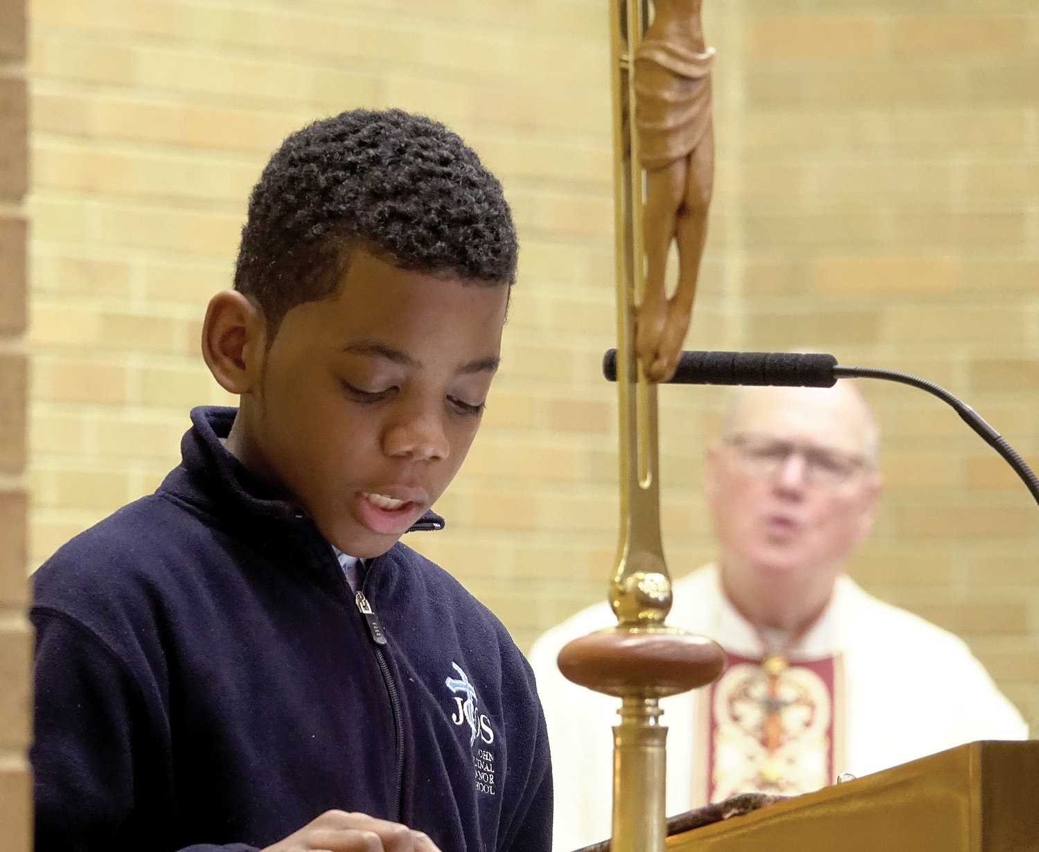 Kennedy Belezaire delivers the Prayer of the Faithful during the morning liturgy.