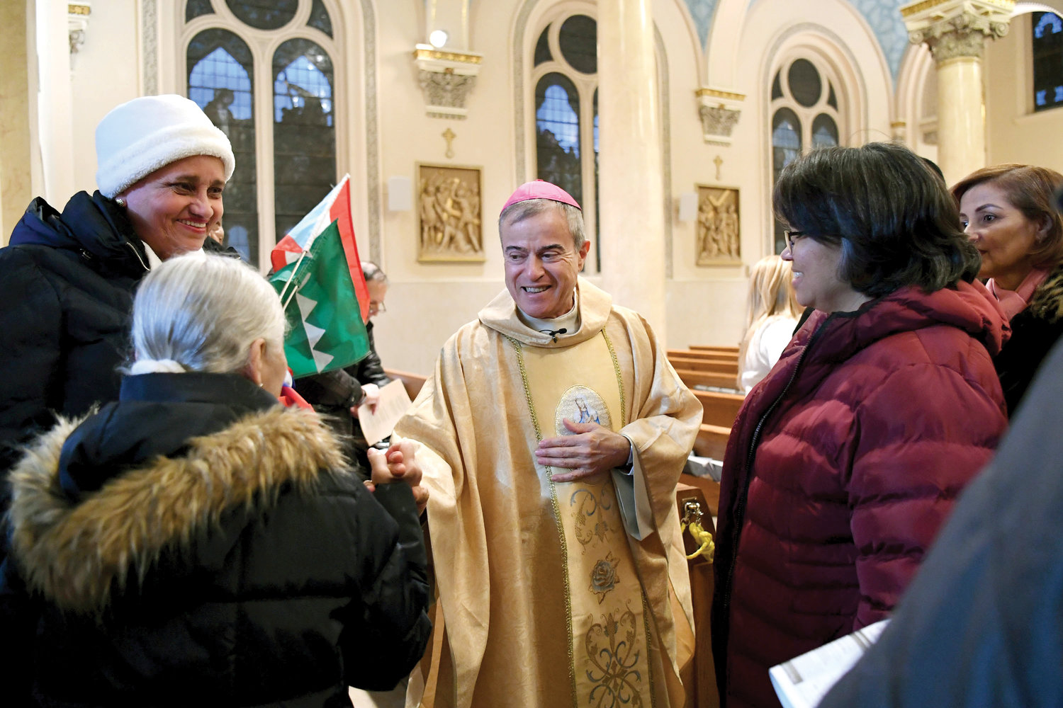 Archbishop Gonzalez warmly greets those who attended the Mass.