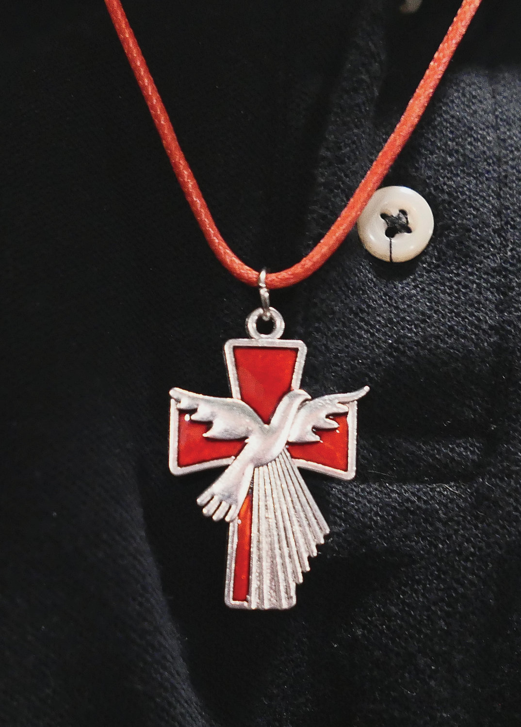 Retreatants were given a medal with the dove symbolizing the Holy Spirit on the cross.