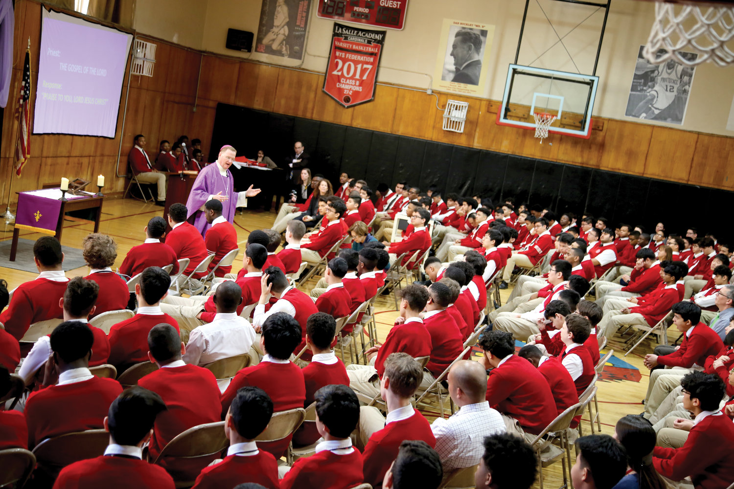 Auxiliary Bishop Edmund Whalen, vicar for clergy in the archdiocese, offers Mass March 2 at La Salle Academy, a boys’ high school in lower Manhattan.