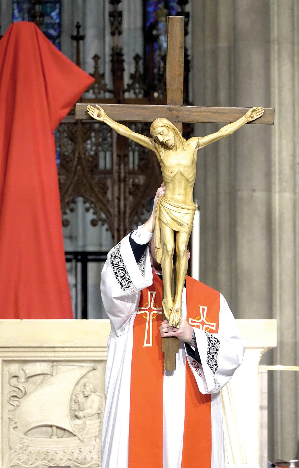 The Showing of the Holy Cross, during the Adoration of the Holy Cross, occurs after the Solemn Intercessions during the celebration of the Passion of the Lord.