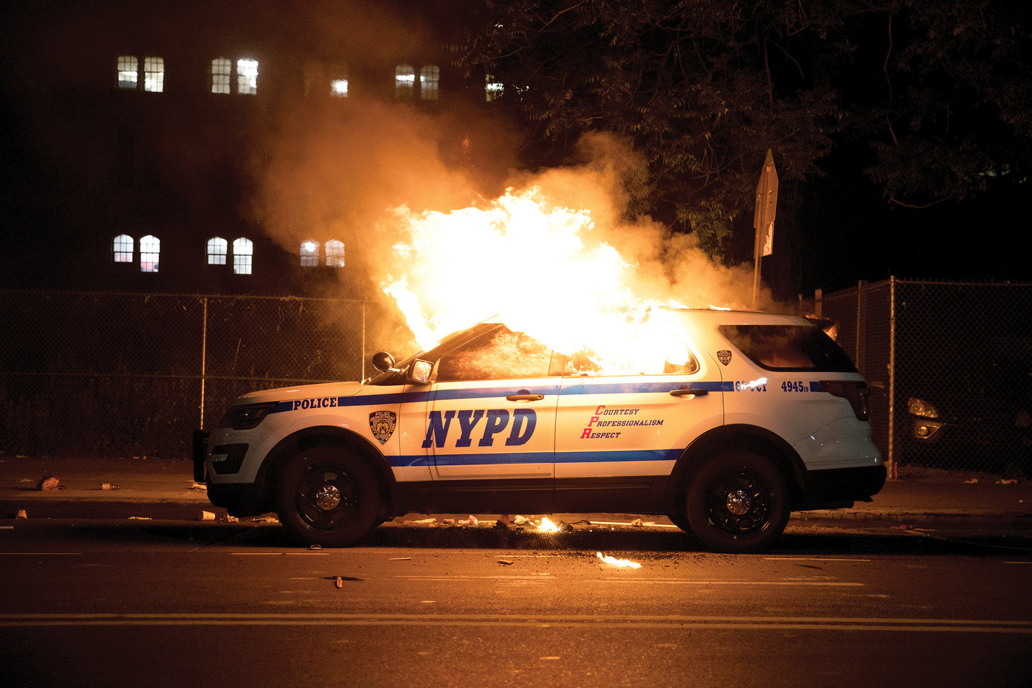 A New York City police car, above, is set on fire May 30.