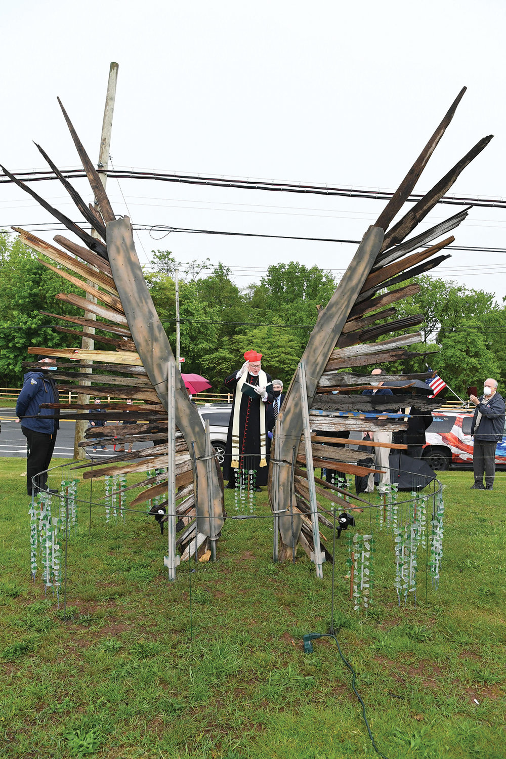 Cardinal Dolan blesses the 942 Voices sculpture at Mount Loretto on Staten Island May 23. The sculpture honors Staten Islanders who have lost their lives during the coronavirus pandemic, including two residents of Mount Loretto residential care facility.