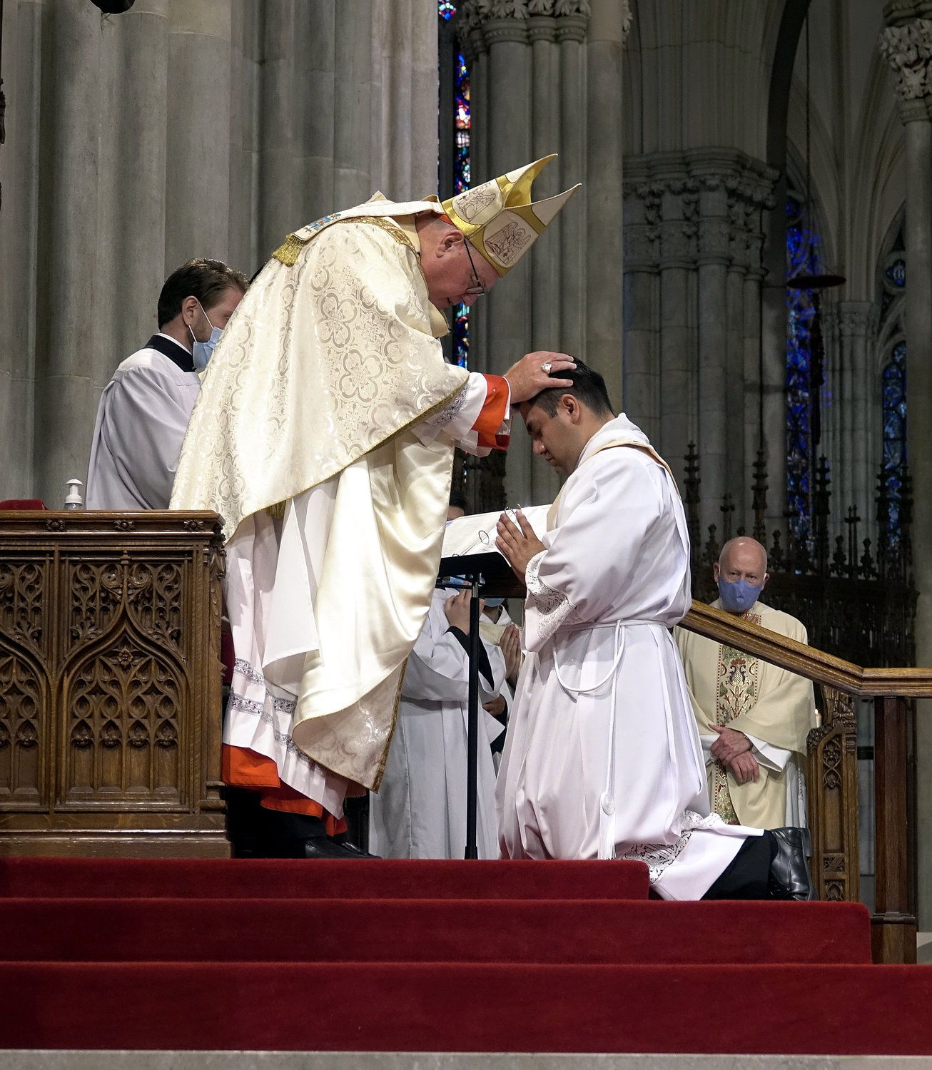 Cardinal Dolan lays hands on Father Luis Silva during the Rite of Ordination.