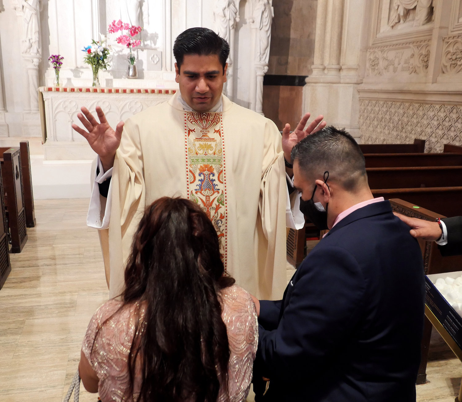 Father Luis Silva offers a first blessing after the Mass of Ordination.