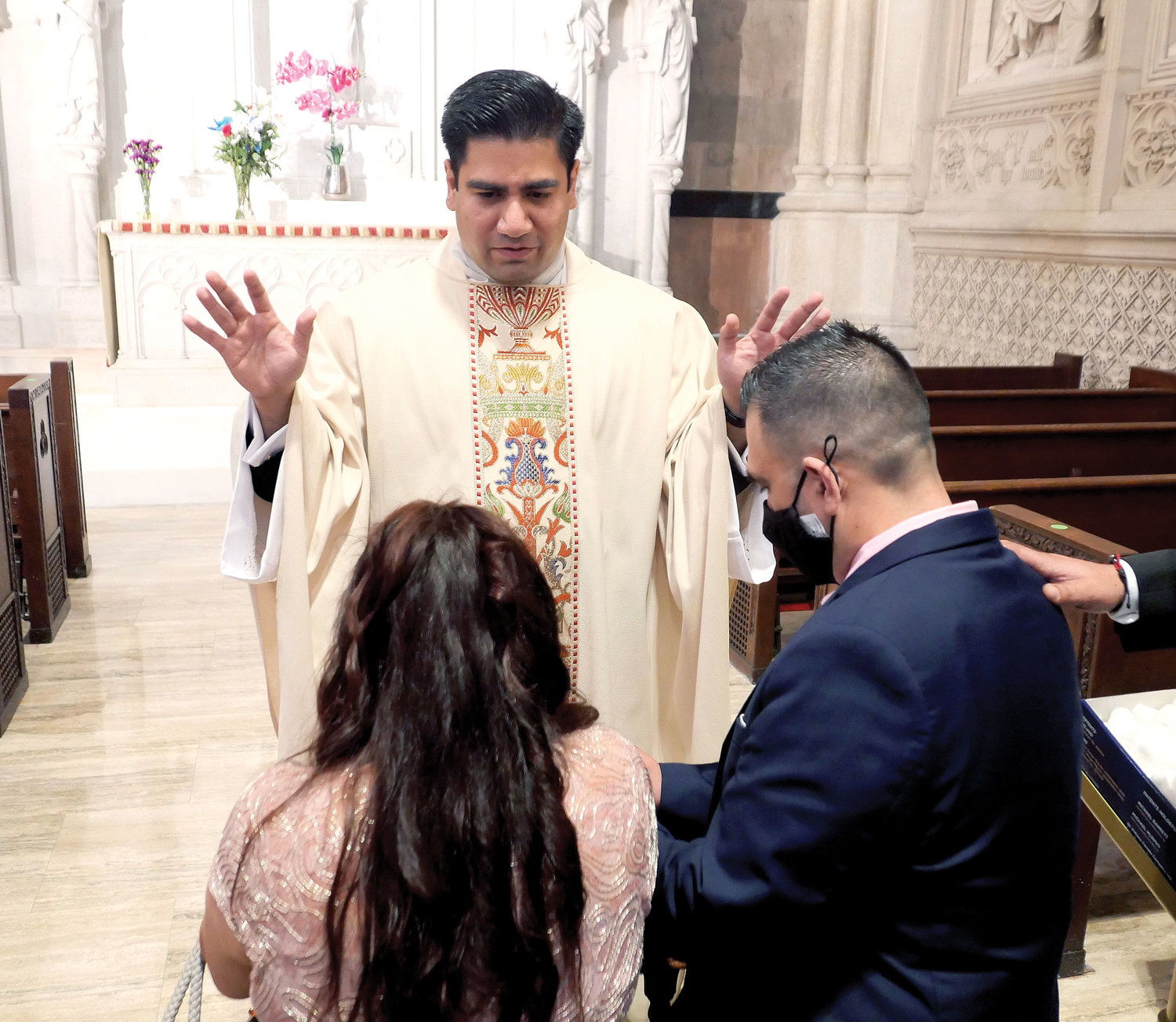 Father Silva offers first blessings near the cathedral’s Our Lady of Guadalupe altar after the liturgy.