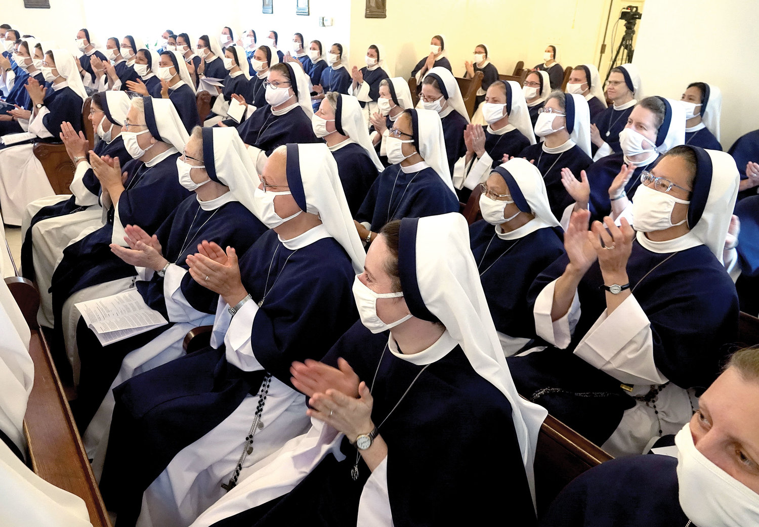 Members of the Sisters of Life applaud two of their own—Sister Virginia Joy, S.V. and Sister Naomi Maria Magnificat, S.V.—who professed solemn vows Aug. 6 in the Chapel of Mary, Mother of the Eucharist at the Sisters of Life Motherhouse, Annunciation in Suffern.