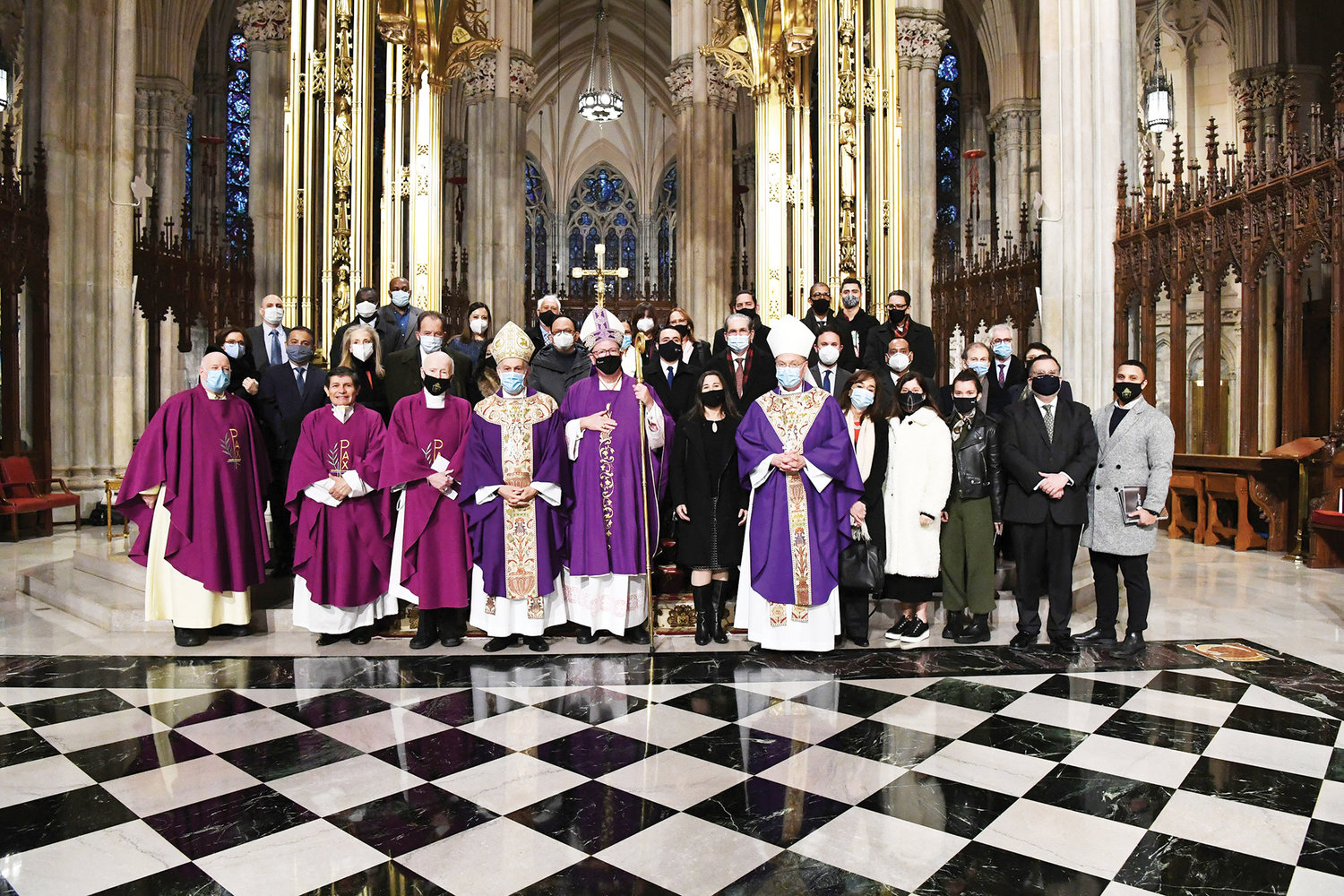 GREETING DIPLOMATS—Latin American consuls general and ambassadors gather for a group photo with Cardinal Dolan and Archbishop Gabriele Caccia, Vatican nuncio to the United Nations, and other clergy at St. Patrick’s Cathedral Dec. 6. This is the third year the diplomats have been invited to attend Mass together.