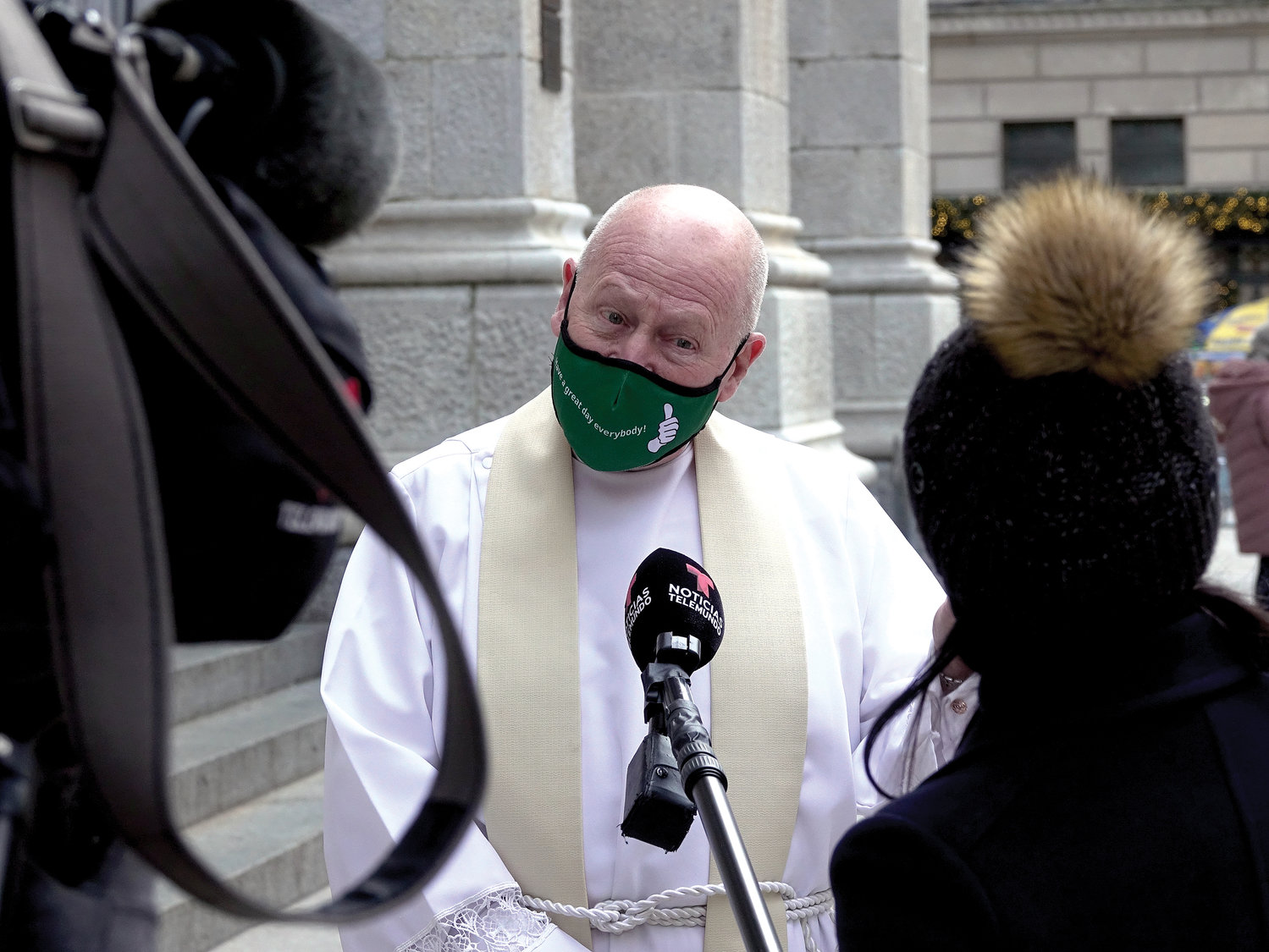 Msgr. Robert Ritchie, rector of St. Patrick’s Cathedral, is interviewed on the cathedral steps.