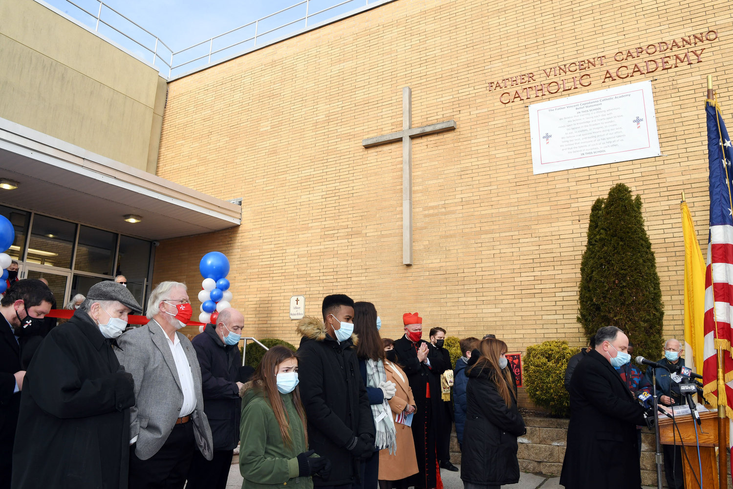 Father Michael Martine, pastor of Holy Rosary parish, gives the opening prayer at the dedication of Father Vincent Capodanno Catholic Academy on Staten Island Jan. 21.