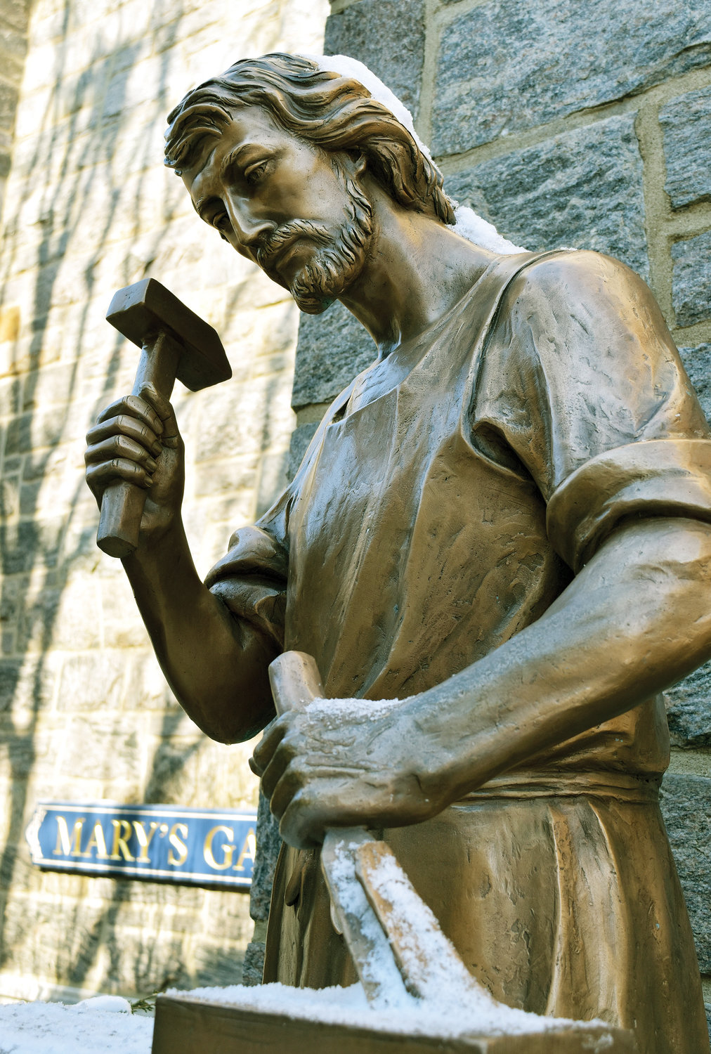 Lifelike bronze statue of St. Joseph at work holds a place of honor at St. Joseph’s parish in Bronxville.
