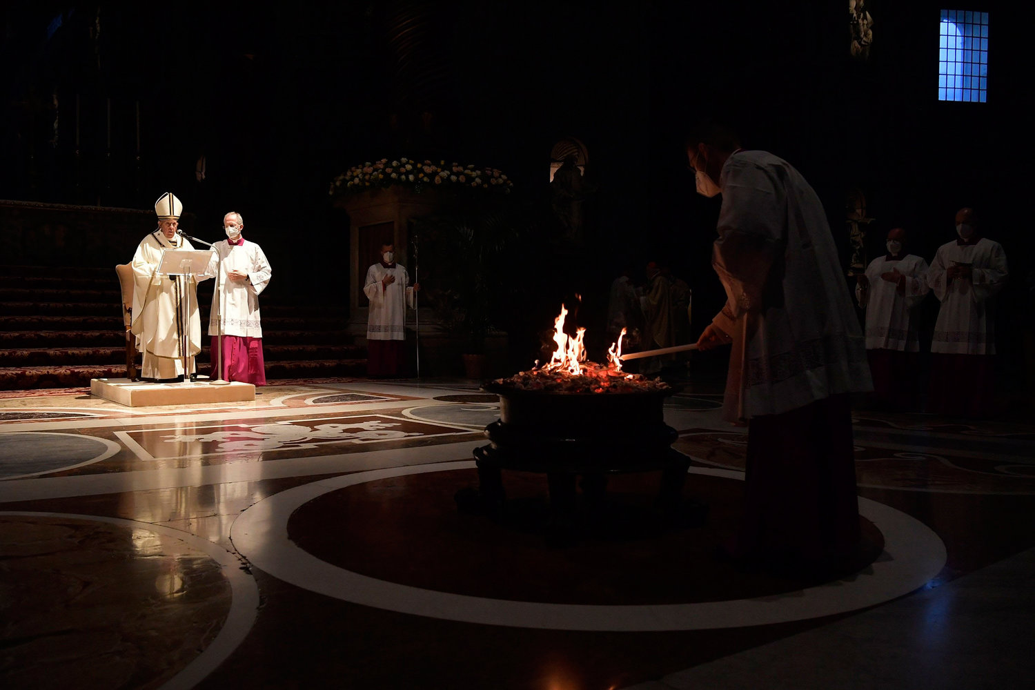 Pope Francis celebrates the Easter Vigil in St. Peter’s Basilica at the Vatican April 3. The Easter Vigil was celebrated in a near empty basilica for the second year in a row as Italy continues to fight the Covid-19 pandemic.