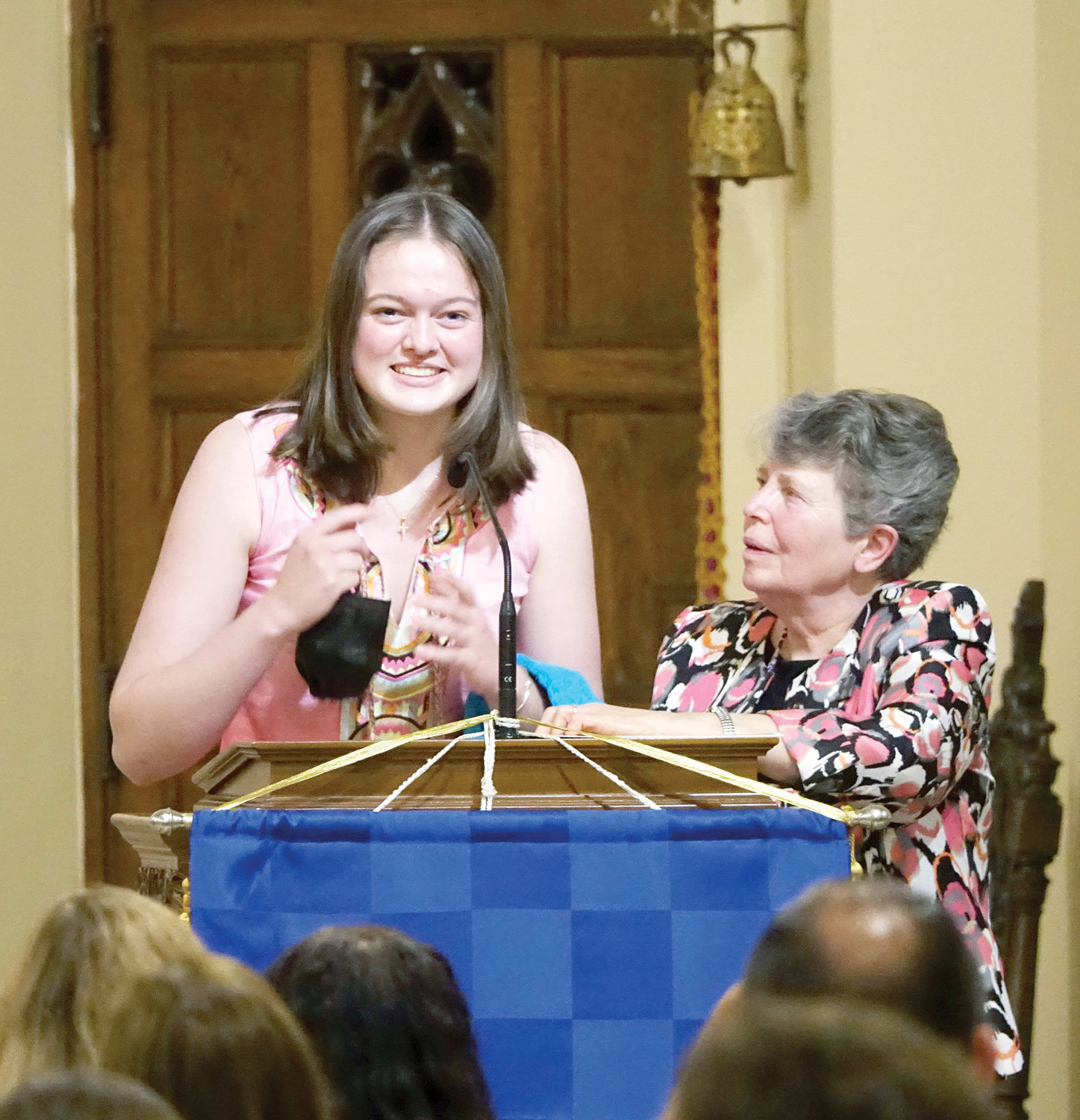 Sophia Soropoulos, a junior at Mamaroneck High School, receives a certificate and other award items from Sister Suzanne Duzen, SS.C.M., the parish’s director of religious education. The awards were conferred by the Sisters of Saints Cyril and Methodius, whose motherhouse is in Danville, Pa. Four sisters from the congregation’s leadership committee traveled to help Sister Suzanne host the ceremony.
