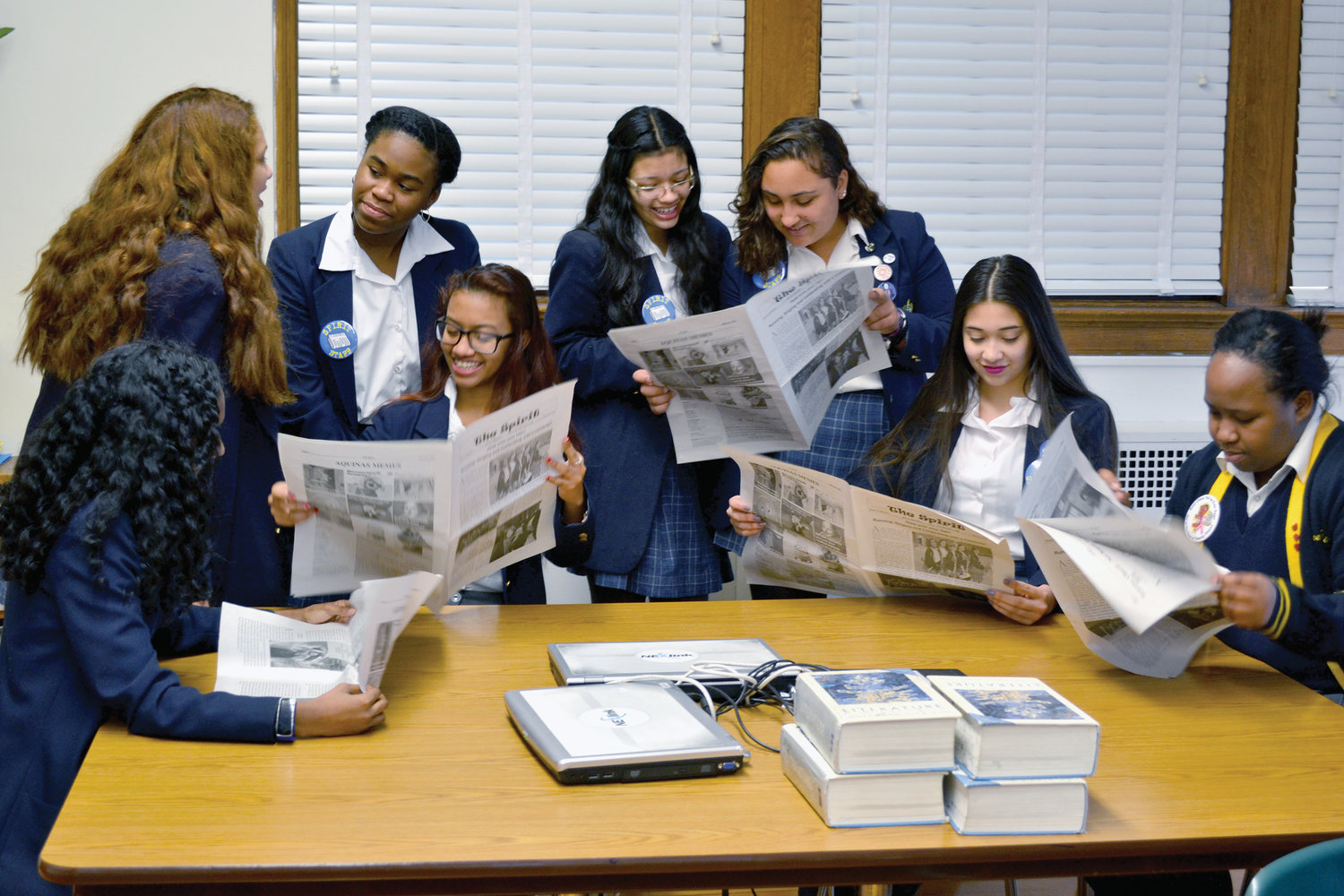 Students read The Spirit, the school newspaper.