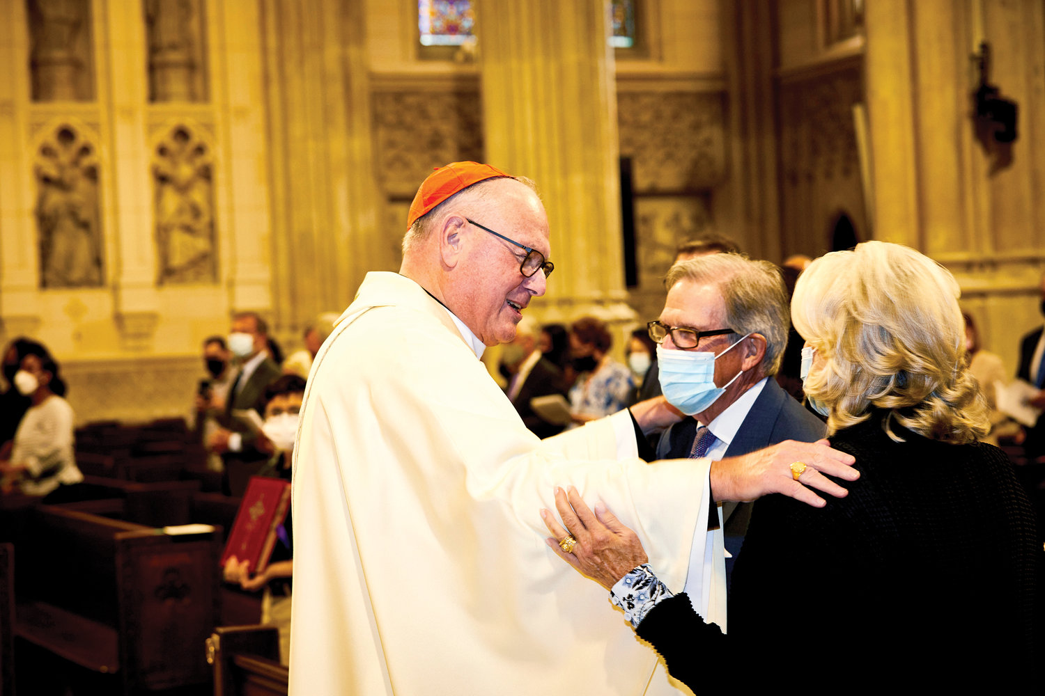 Cardinal Dolan greets Peter T. Grauer and his wife Laurie. Grauer is president of the Inner-City Scholarship Fund’s Board of Trustees.