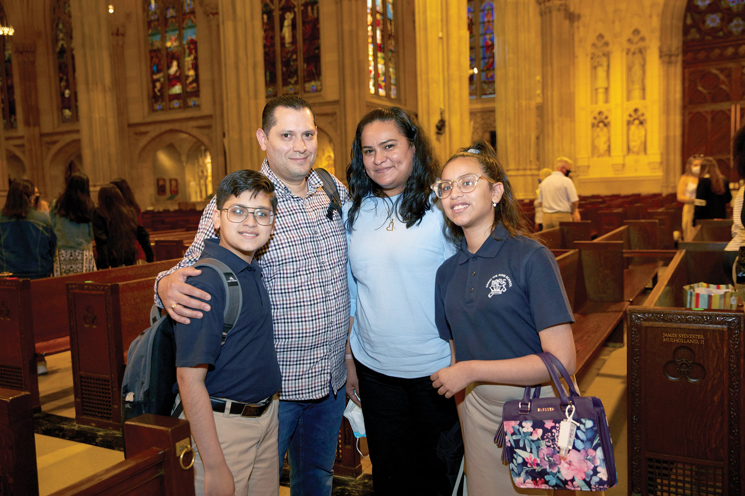Eligio and Mercedes Solis stand with their children, Salette and Eli, after a Mass celebrating the 50th anniversary of the Inner-City Scholarship Fund at St. Patrick’s Cathedral May 25. Salette and Eli are scholarship recipients who attend Christ the King School in the Bronx, and they were altar servers at the Mass.