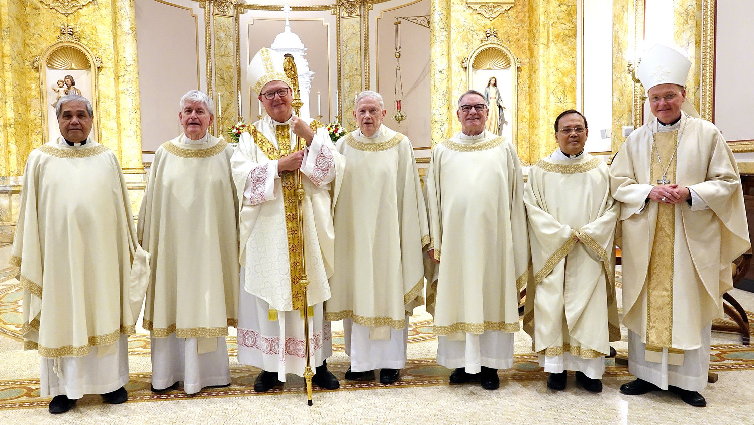 Members of the Ordination Class of 1970 join Cardinal Dolan, center, and Auxiliary Bishop Edmund Whalen, vicar for clergy, right. From left, the jubilarians are Father Joseph Victor Maynigo-Arenas, Msgr. Michael Crimmins, Father Patrick Dunne,  Msgr. James Sullivan and Father Jose Marabe.