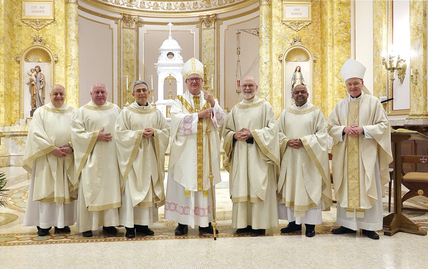 Members of the Ordination Class of 1995 join Cardinal Dolan, center, and Msgr. Joseph LaMorte, vicar general and moderator of the curia, left, and Auxiliary Bishop Edmund Whalen, vicar for clergy, right. From left, the jubilarians are Father David Nolan, Father Jose Serrano, Father Donald Baker and Father Cosme Fernandes.