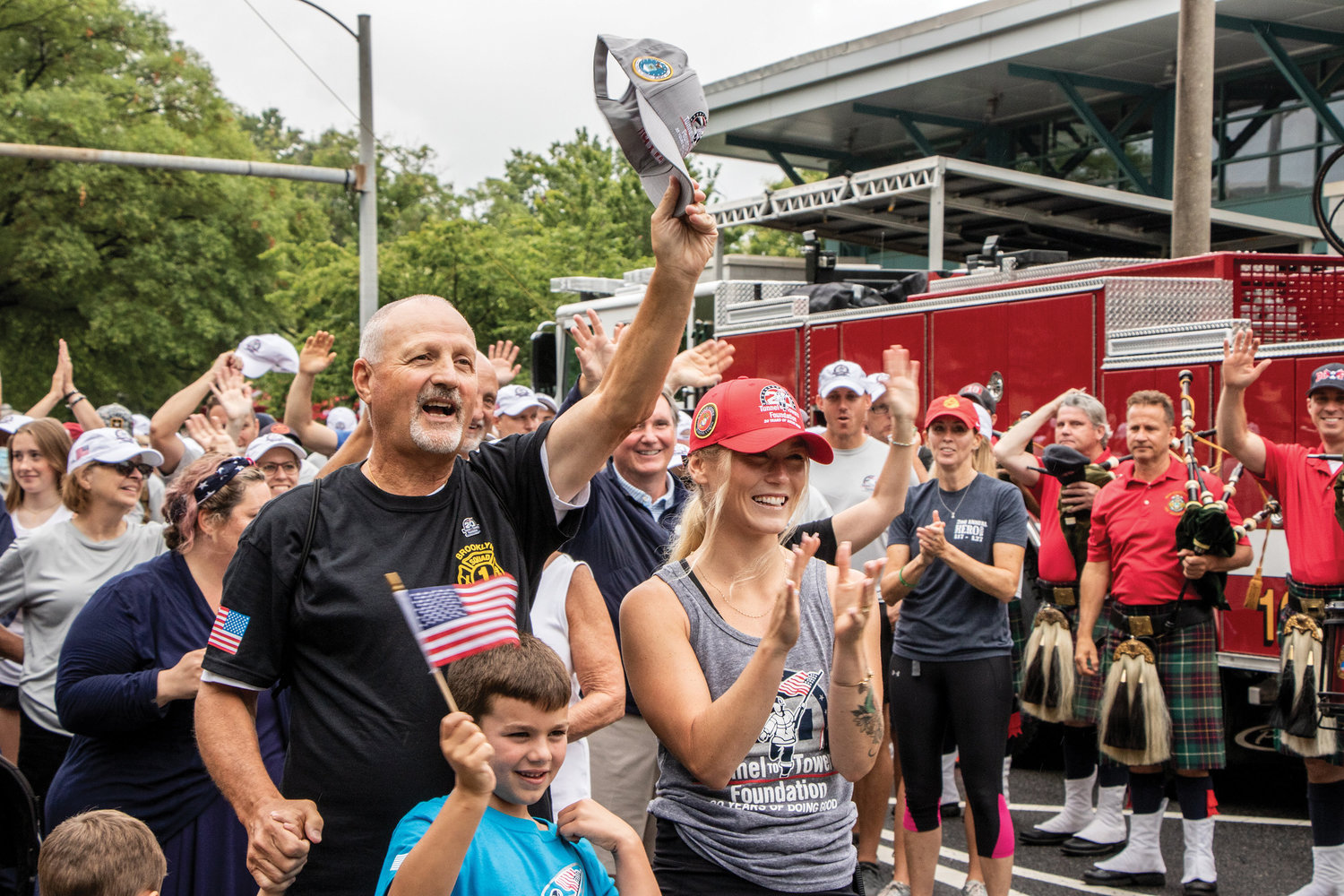 Frank Siller, chairman and CEO of the Tunnel to Towers Foundation, waves his hat outside of a fire station in Arlington, Va., Aug. 1, as he and other participants begin the "Never Forget Walk" in memory of the nearly 3,000 lives lost during the 9/11 terrorist attacks. The 500-mile-plus walk began near the Pentagon, then headed to Shanksville, Pa., and was to end close to Sept. 11, the 20th anniversary of 9/11, at the site of the former World Trade Center’s Twin Towers in Lower Manhattan.
