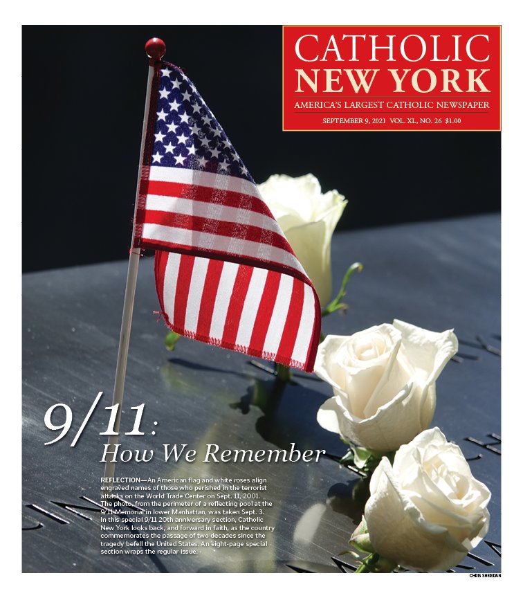 An American flag and white roses align engraved names of those who perished in the terrorist attacks on the World Trade Center on Sept. 11, 2001. The photo, from the perimeter of a reflecting pool at the 9/11 Memorial in lower Manhattan, was taken Sept. 3. In this special 9/11 20th anniversary section, Catholic New York looks back, and forward in faith, as the country commemorates the passage of two decades since the tragedy befell the United States. An eight-page special section wraps the regular issue.