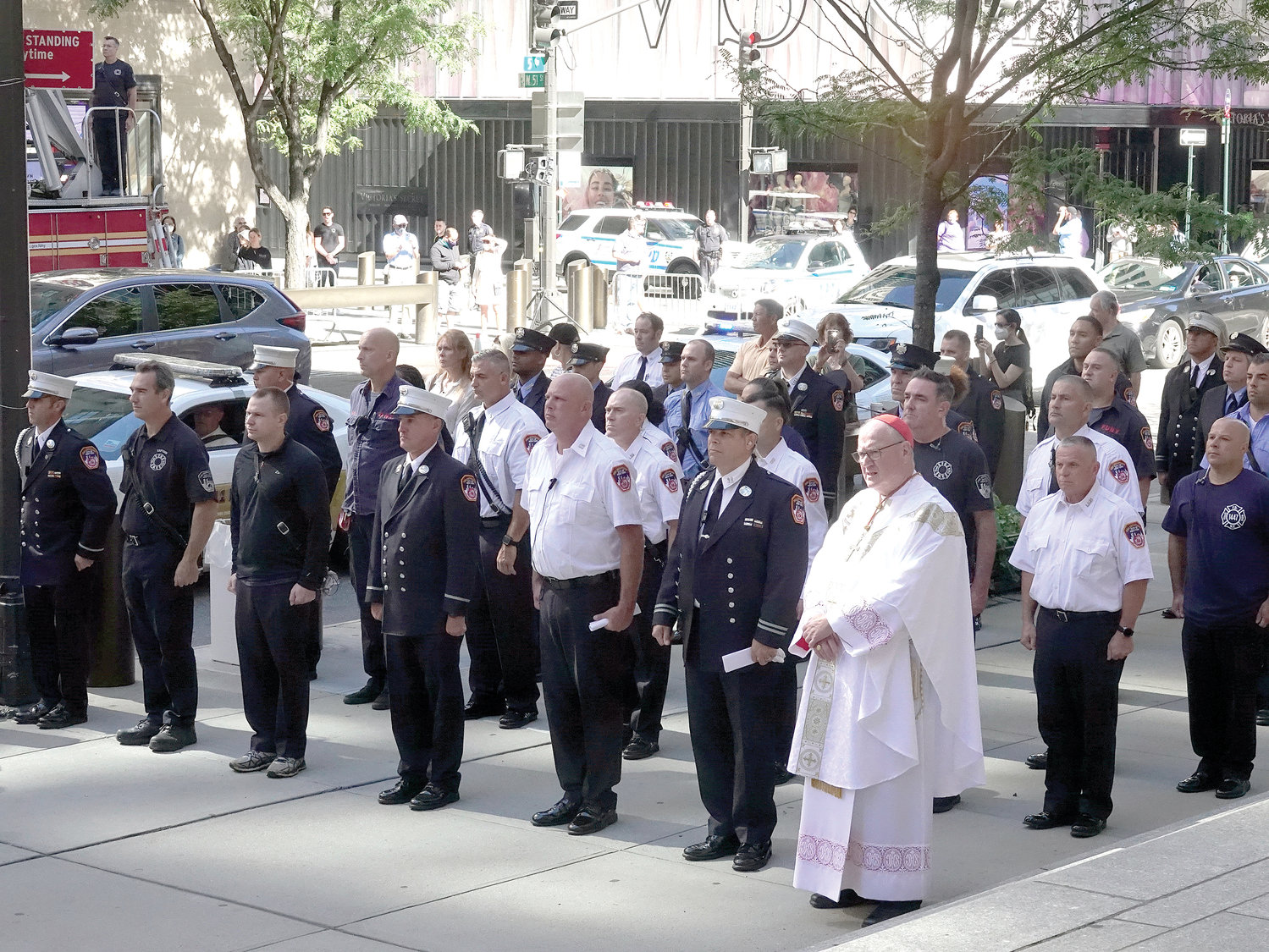 IN SOLIDARITY—Cardinal Dolan gathers with members of the FDNY outside St. Patrick’s Cathedral before a morning Mass he celebrated Sept. 11 for them and for families of firefighters who were killed in the terror attacks on the World Trade Center two decades ago on 9/11.