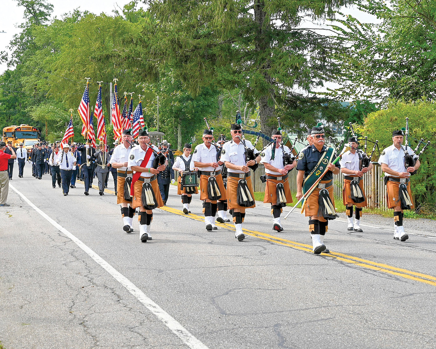 Led by bagpipers, firefighters, police officers and other first responders process to Mass at St. John the Evangelist Church on East Lake Boulevard in Mahopac Sept. 12 to mark the 20th anniversary of 9/11. The pastor, Father Philip Caruso, was principal celebrant and homilist.