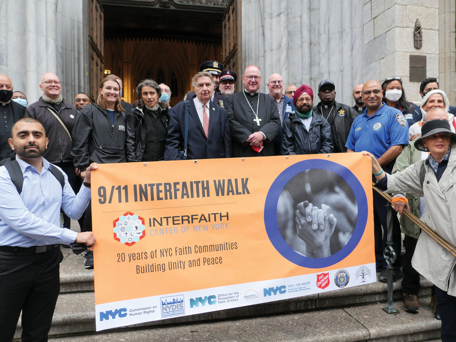 Rabbi Joseph Potasnik and Cardinal Dolan assemble alongside  marchers of the 9/11 Interfaith Peace Walk outside St. Patrick’s Cathedral Sept. 9. The cathedral was one of five houses of worship on the walk’s Midtown Manhattan East route.