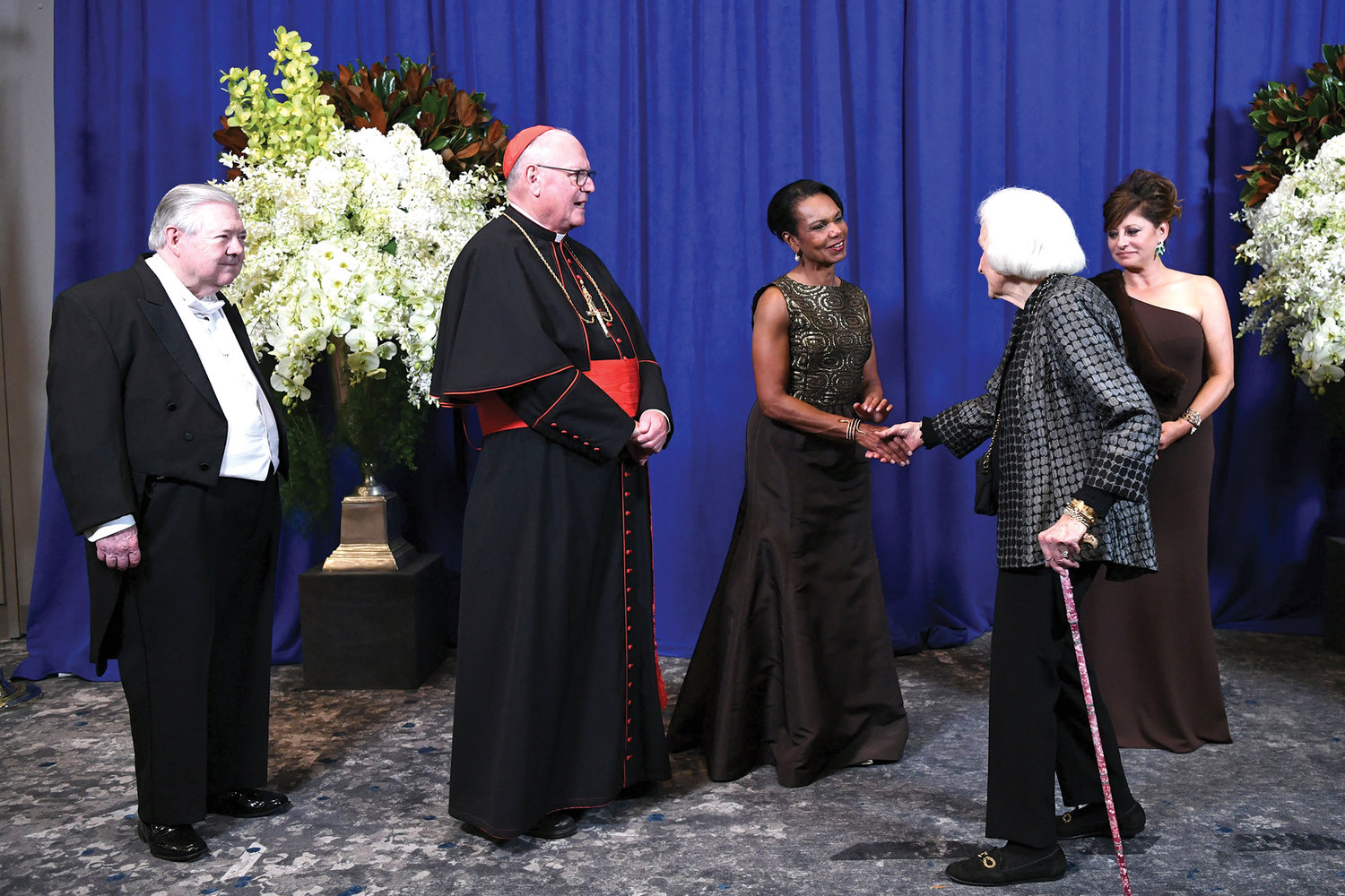 Honored guests line up in the receiving line for the 76th annual Alfred E. Smith Memorial Foundation Dinner Oct. 21 at the Javits Center in Manhattan. From left, Frank Bennack, Jr., Cardinal Dolan, Condoleezza Rice and journalist Maria Bartiromo, mistress of ceremonies.