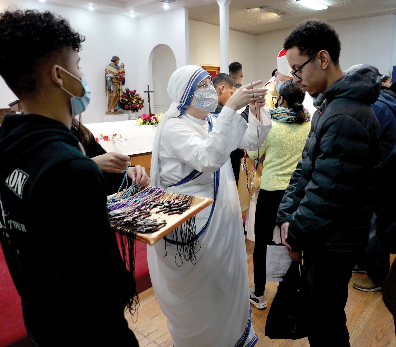 A weekend of prayer and solidarity with the poor was celebrated Nov. 13-14 at St. Rita of Cascia Church in the South Bronx. Parish evangelizers receive crosses and rosaries at a commissioning ceremony.